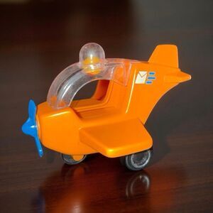 Vintage Tumble Wheels Dome Top Post Office Mail Airplane Orange Plastic A47